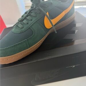 Nike Dark Green Suede Low-Top Sneakers with Orange Swoosh